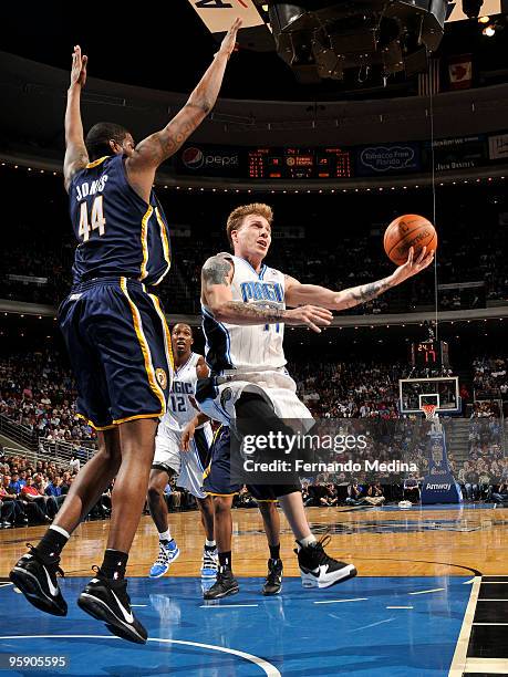 Jason Williams of the Orlando Magic shoots against Solomon Jones of the Indiana Pacers during the game on January 20, 2010 at Amway Arena in Orlando,...