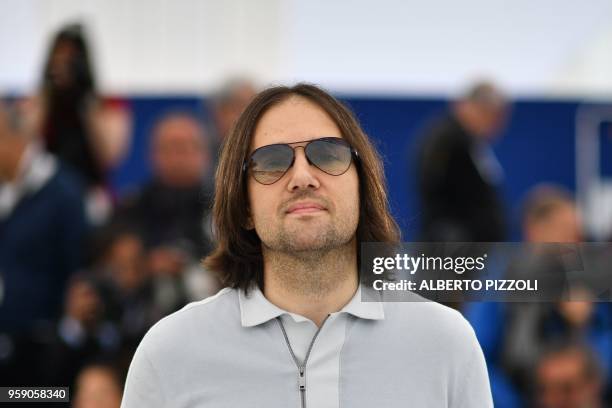 Director David Robert Mitchell poses on May 16, 2018 during a photocall for the film "Under the Silver Lake" at the 71st edition of the Cannes Film...