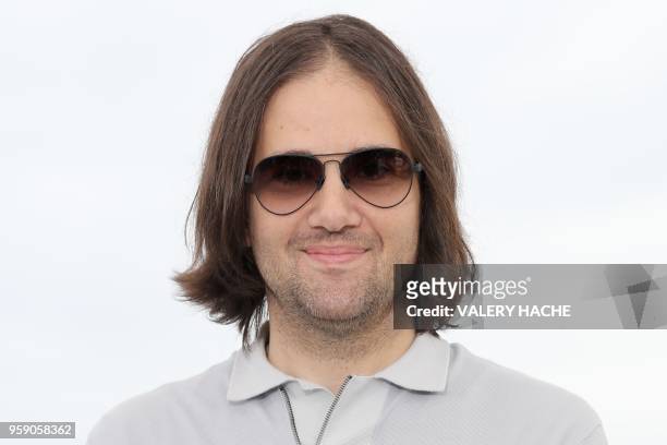 Director David Robert Mitchell poses on May 16, 2018 during a photocall for the film "Under the Silver Lake" at the 71st edition of the Cannes Film...