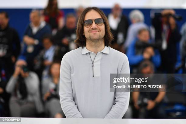 Director David Robert Mitchell poses on May 16, 2018 during a photocall for the film "Under the Silver Lake" at the 71st edition of the Cannes Film...