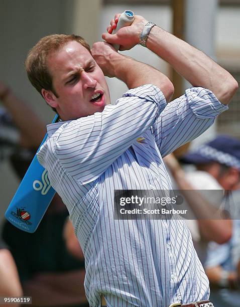 Prince William bats as he plays a game of cricket at the Flowerdale temporary village as he visits people affected by the 2009 bushfires on the third...