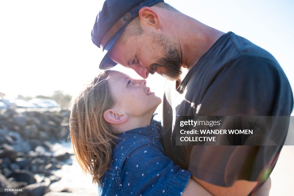 Father eskimo kisses his son