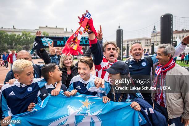 Fans of Marseille and Atletico celebrate at the Fan Zone ahead of the UEFA Europa League Final between Olympique de Marseille and Club Atletico de...