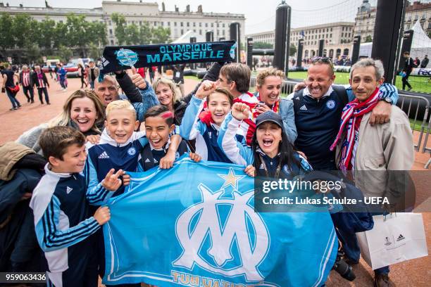 Fans of Marseille and Atletico celebrate at the Fan Zone ahead of the UEFA Europa League Final between Olympique de Marseille and Club Atletico de...