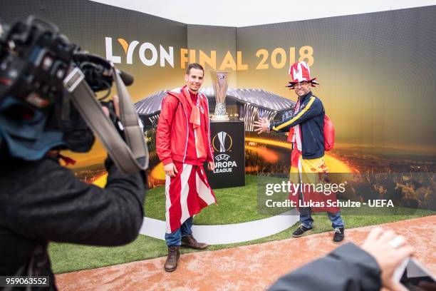 Fans of Madrid pose with the trophy at the Fan Zone ahead of the UEFA Europa League Final between Olympique de Marseille and Club Atletico de Madrid...