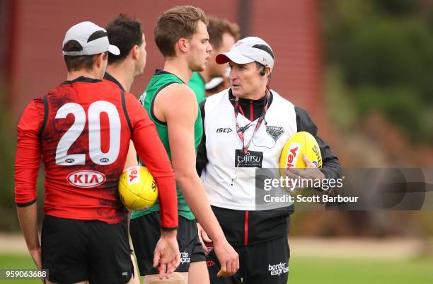 John Worsfold, coach of the Bombers looks at Jordan Ridley during an Essendon Bombers AFL training session at The Hangar on May 16, 2018 in...
