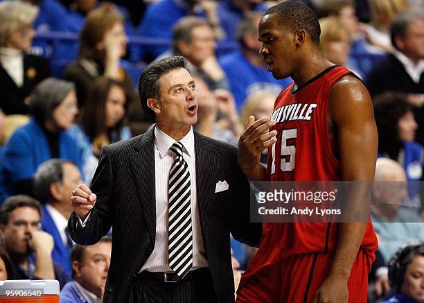 Rick Pitino the Head Coach of the Louisville Cardinals gives instructions to Samardo Samuels during the game against the Kentucky Wildcats at Rupp...