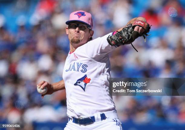 Tyler Clippard of the Toronto Blue Jays delivers a pitch in the ninth inning during MLB game action against the Boston Red Sox at Rogers Centre on...