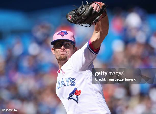 Tyler Clippard of the Toronto Blue Jays delivers a pitch in the eighth inning during MLB game action against the Boston Red Sox at Rogers Centre on...