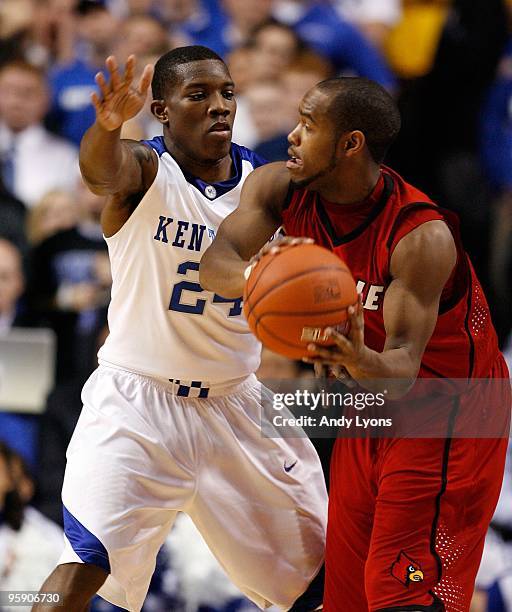 Eric Bledsoe of the Kentucky Wildcats defends Preston Knowles of the Louisville Cardinals at Rupp Arena on January 2, 2010 in Lexington, Kentucky....