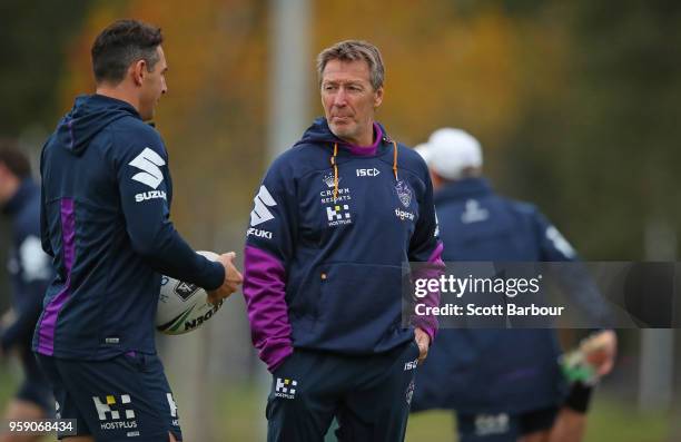 Billy Slater of the Melbourne Storm and Storm coach Craig Bellamy talk during a Melbourne Storm NRL media session at Gosch's Paddock on May 16, 2018...