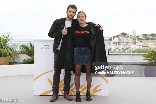 Portuguese film director Joao Salaviza and Brazilian film director Renee Nader Messora pose on May 16, 2018 during a photocall for the film "The Dead...