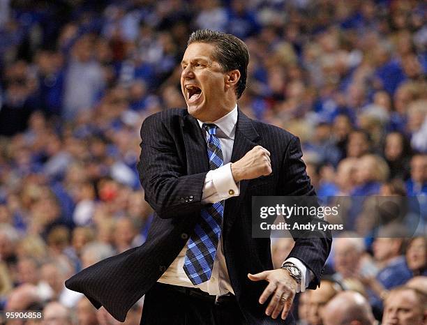 John Calipari the Head Coach of the Kentucky Wildcats gives instructions to his team during the game against the Louisville Cardinals at Rupp Arena...