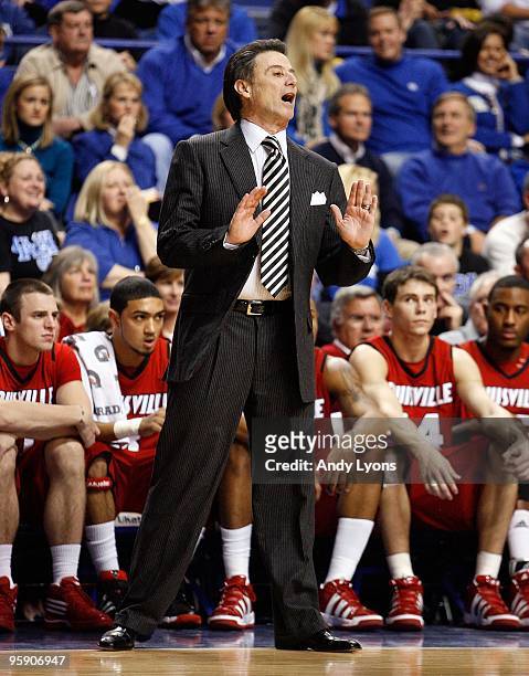 Rick Pitino the Head Coach of the Louisville Cardinals gives instructions to his team during the game against the Kentucky Wildcats at Rupp Arena on...
