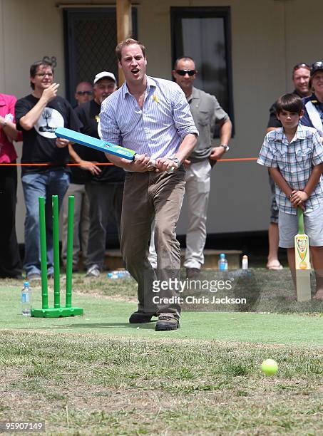 Prince William plays cricket as he visits the bushfire affected township of Flowerdale on the third day of his visit to Australia on January 21, 2010...