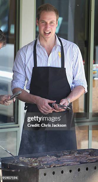 Prince William cooks on a BBQ as he visits the bushfire affected township of Flowerdale on the third day of his visit to Australia on January 21,...