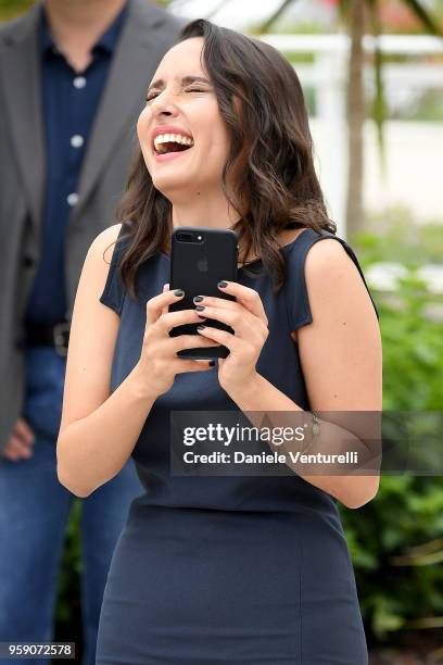 Actress Sarah Perles takes a picture with her phone as she attends the photocall for the "Sofia" during the 71st annual Cannes Film Festival at...