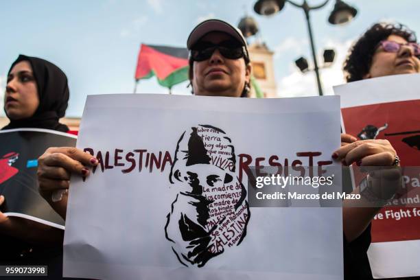 Woman with a placard that reads "Palestine resist" protesting against the last deaths in Gaza Strip coinciding with the Nakba Day. Palestinians...