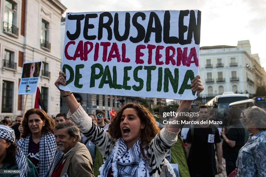 A woman with a placard that reads "Jerusalem eternal capital...