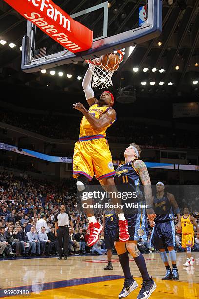 Corey Maggette of the Golden State Warriors dunks against Chris Andersen of the Denver Nuggets on January 20, 2010 at Oracle Arena in Oakland,...