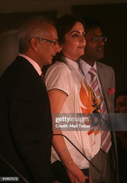 Co-owner of Mumbai Indians team Neeta Ambani and Jay Mehta alongwith Lalit Modi attend a press conference after the Indian Premier League auction at...