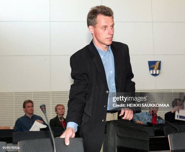 The former coach of the Finnish cross-country ski team Kari-Pekka Kyroe takes a seat 15 June 2004 on the first day of his trial on charges of...