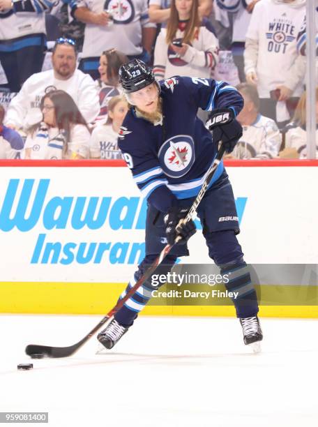 Patrik Laine of the Winnipeg Jets plays the puck during first period action against the Vegas Golden Knights in Game One of the Western Conference...