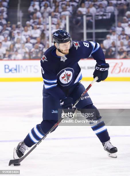 Jacob Trouba of the Winnipeg Jets plays the puck at the point during first period action against the Vegas Golden Knights in Game One of the Western...