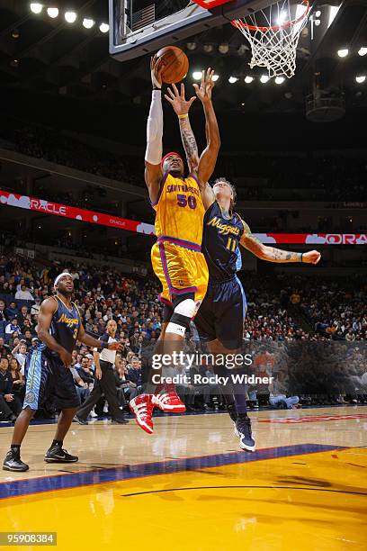 Corey Maggette of the Golden State Warriors scores against Chris Andersen of the Denver Nuggets on January 20, 2010 at Oracle Arena in Oakland,...