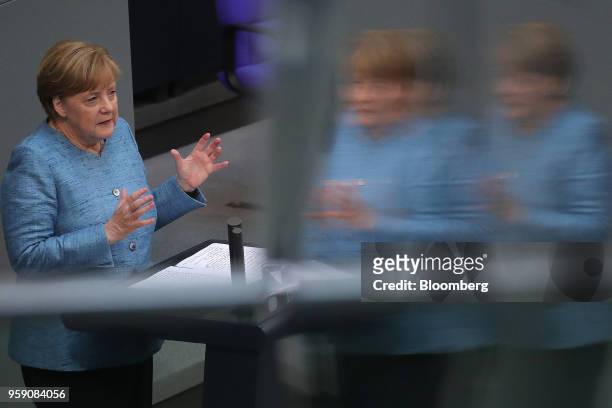 Angela Merkel, Germany's chancellor, gestures while speaking during a budget policy plan debate in the lower-house of the Bundestag in Berlin,...