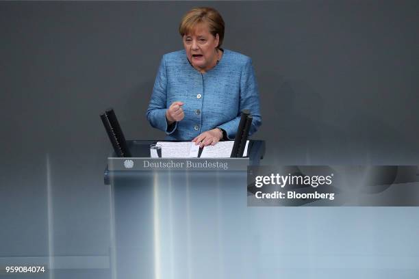 Angela Merkel, Germany's chancellor, gestures while speaking during a budget policy plan debate in the lower-house of the Bundestag in Berlin,...