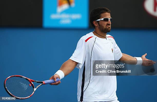 Janko Tipsarevic of Serbia reacts after a point in his second round match against Tommy Haas of Germany during day four of the 2010 Australian Open...