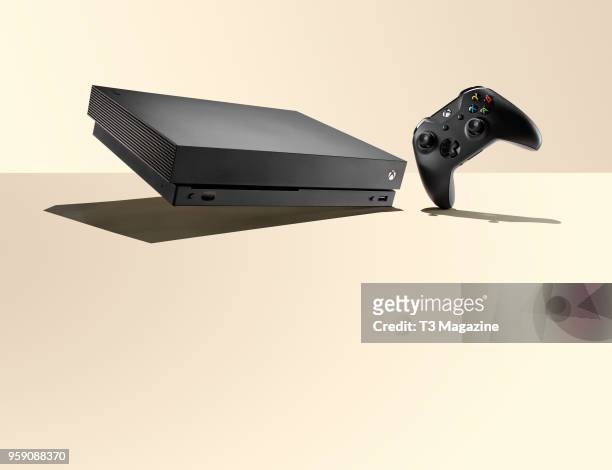 Microsoft Xbox One X home console and wireless controller, taken on October 24, 2017.