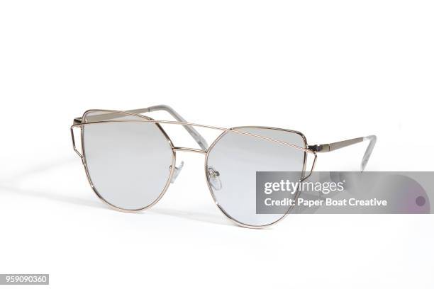 generic sunglasses set against a plain white background shot in the studio - タギグ ストックフォトと画像