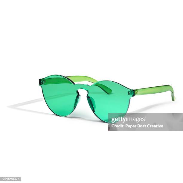 generic sunglasses set against a plain white background shot in the studio - タギグ ストックフォトと画像