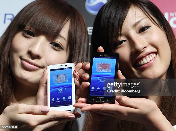 Models pose with Xperia smart phones during the launch held by Sony Ericsson Mobile Communications AB and NTT DoCoMo Inc. In Tokyo, Japan, on...