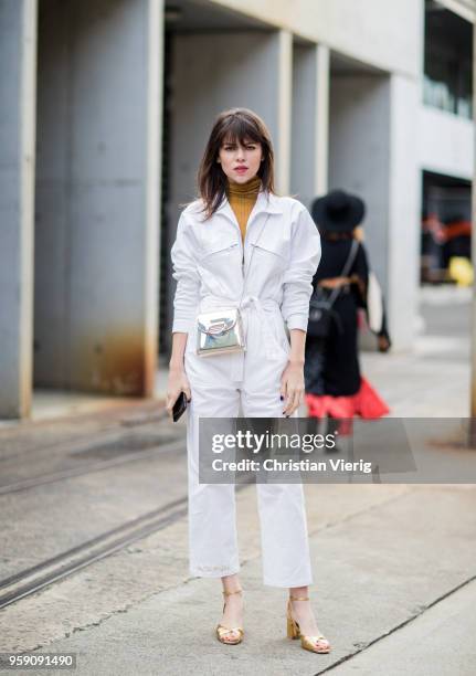 Model Georgia Fowler wearing white overall during Mercedes-Benz Fashion Week Resort 19 Collections at Carriageworks on May 16, 2018 in Sydney,...