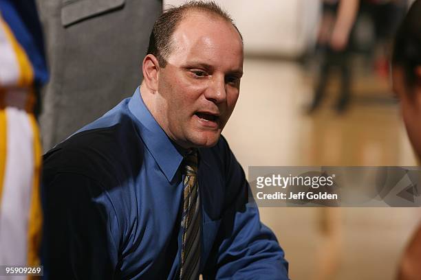 Head coach Tim La Kose of the Bakersfield Roadrunners instructs his team during a timeout in the first half of the women's college basketball game...