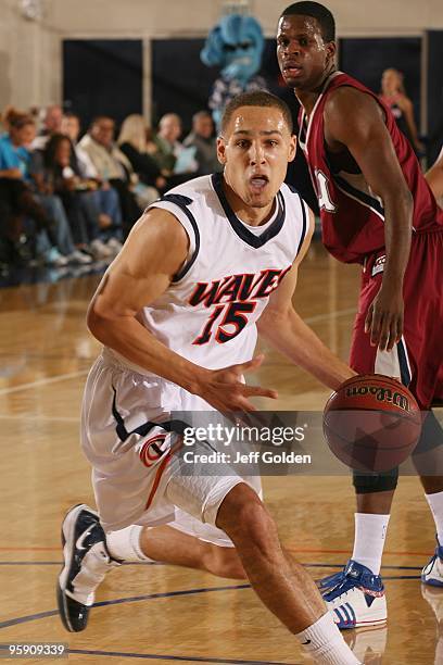 Mychel Thompson of the Pepperdine Waves drives during the second half of the men's college basketball game against the Loyola Marymount Lions on...