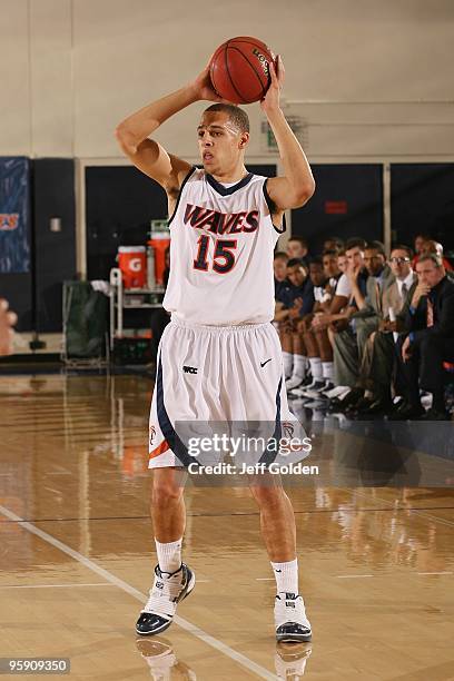 Mychel Thompson of the Pepperdine Waves looks to pass the ball during the second half of the men's college basketball game against the Loyola...