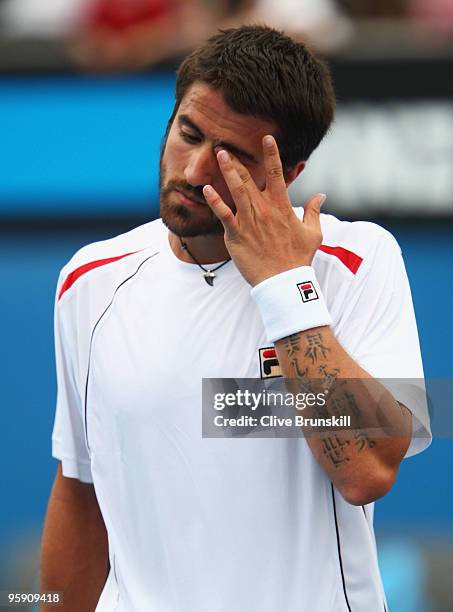 Janko Tipsarevic of Serbia reacts after a point in his second round match against Tommy Haas of Germany during day four of the 2010 Australian Open...