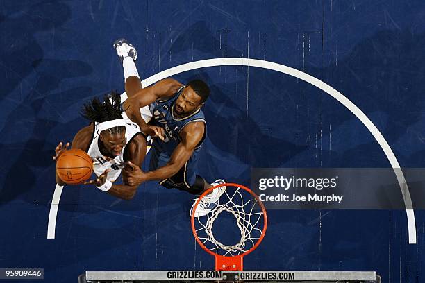 DeMarre Carroll of the Memphis Grizzlies goes up for a shot against Gilbert Arenas of the Washington Wizards during the game at the FedExForum on...