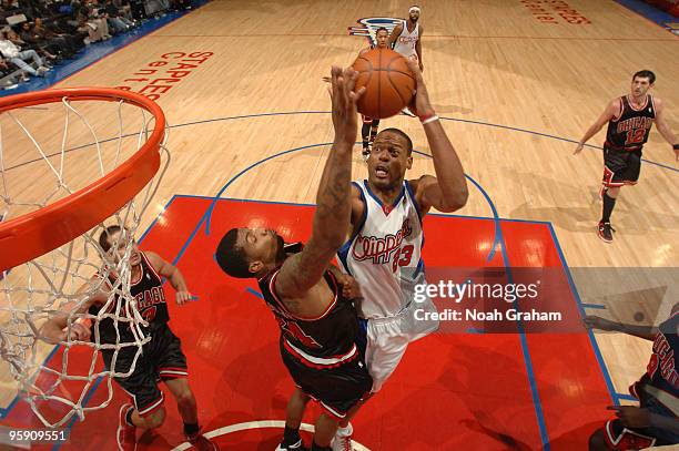 Marcus Camby of the Los Angeles Clippers goes up for a shot against Tyrus Thomas of the Chicago Bulls at Staples Center on January 20, 2010 in Los...