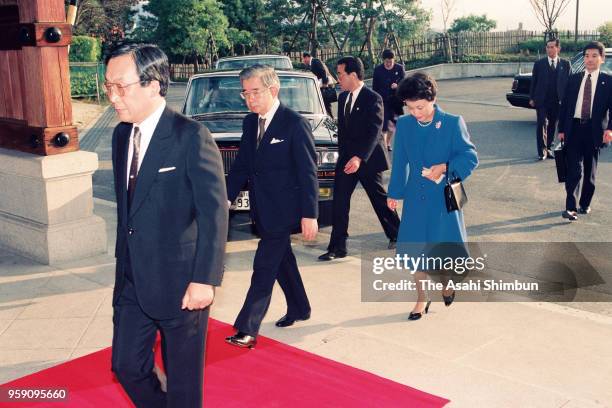 Prince Hitachi and Princess Hanako of Hitachi are seen on arrival at their hotel ahead of Emperor Akihito and Empress Michiko's visit on December 1,...