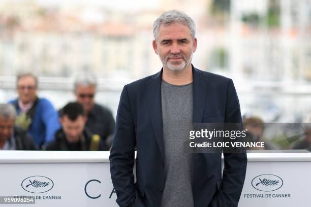 French director Stephane Brize poses on May 16, 2018 during a photocall for the film "At war " at the 71st edition of the Cannes Film Festival in...