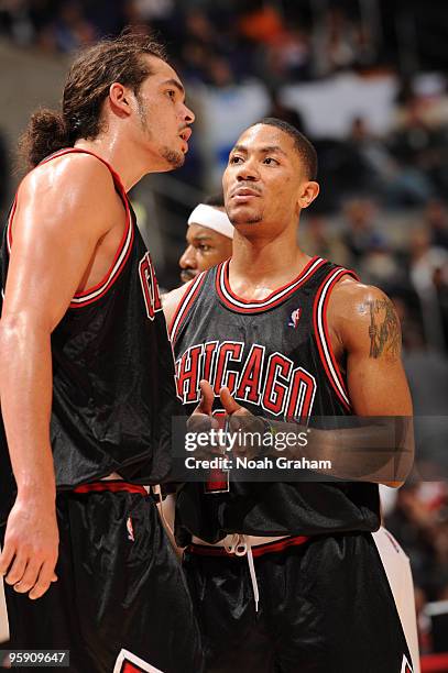 Joakim Noah and Derrick Rose of the Chicago Bulls share a word during their game against the Los Angeles Clippers at Staples Center on January 20,...