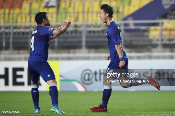 Kim Gun-hee of Suwon Samsung Bluewings celebrates scoring the opening goal with his team mate Kim Eun-sun during the AFC Champions League Round of 16...