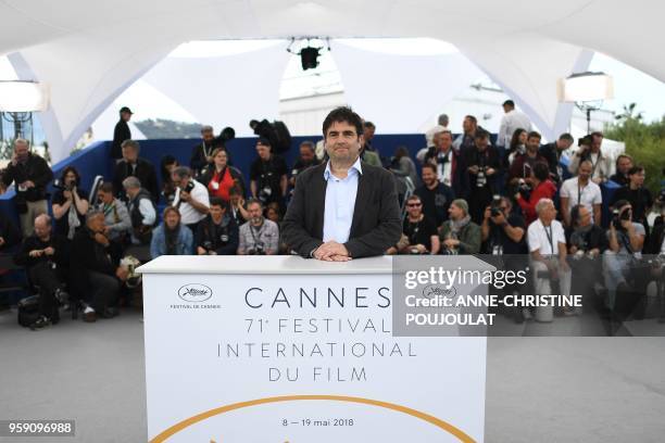 French director Romain Goupil poses on May 16, 2018 during a photocall for the film "On the Road in France " at the 71st edition of the Cannes Film...