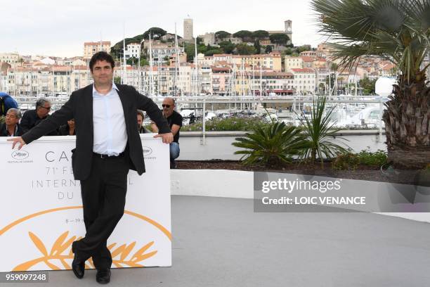 French director Romain Goupil poses on May 16, 2018 during a photocall for the film "On the Road in France " at the 71st edition of the Cannes Film...