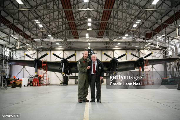 Wing Commander John Butcher, Commanding Officer of 617 Squadron, jokes with Britain's last surviving 'Dambuster', Squadron Leader George "Johnny"...